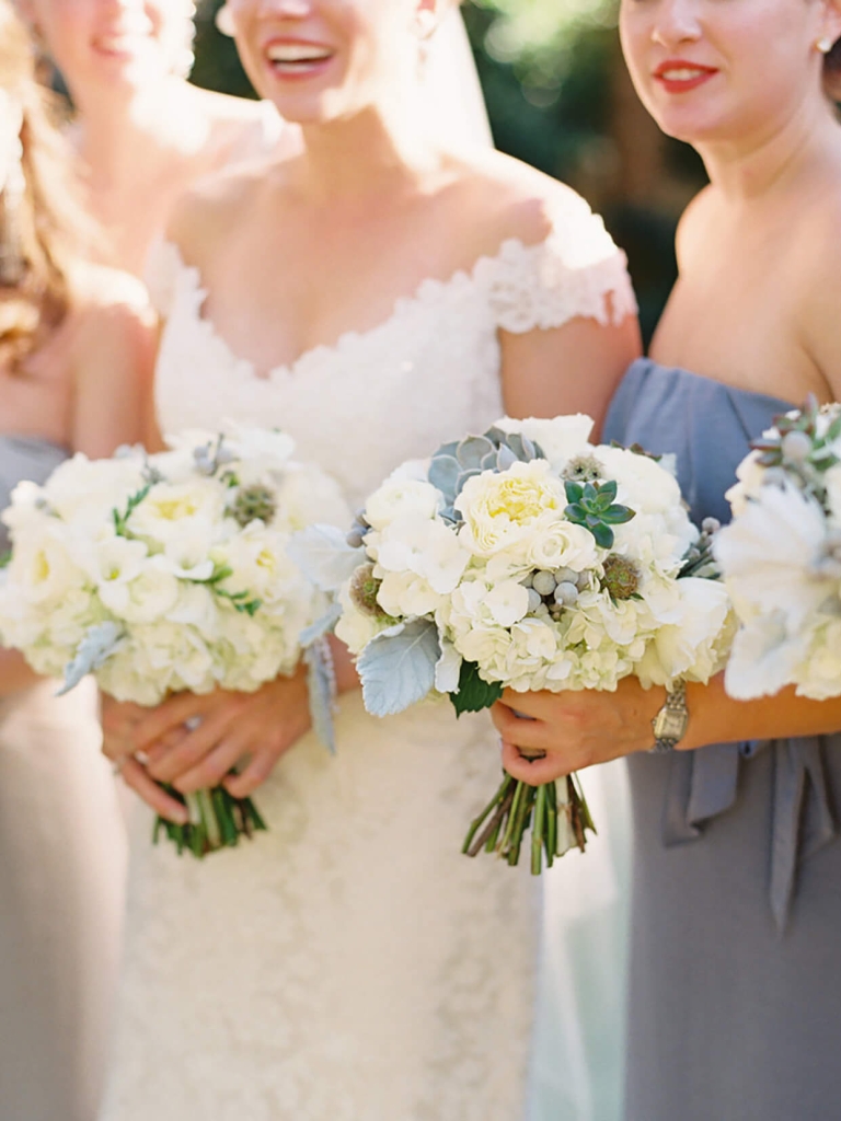 bride and bridesmaids holding bouquets